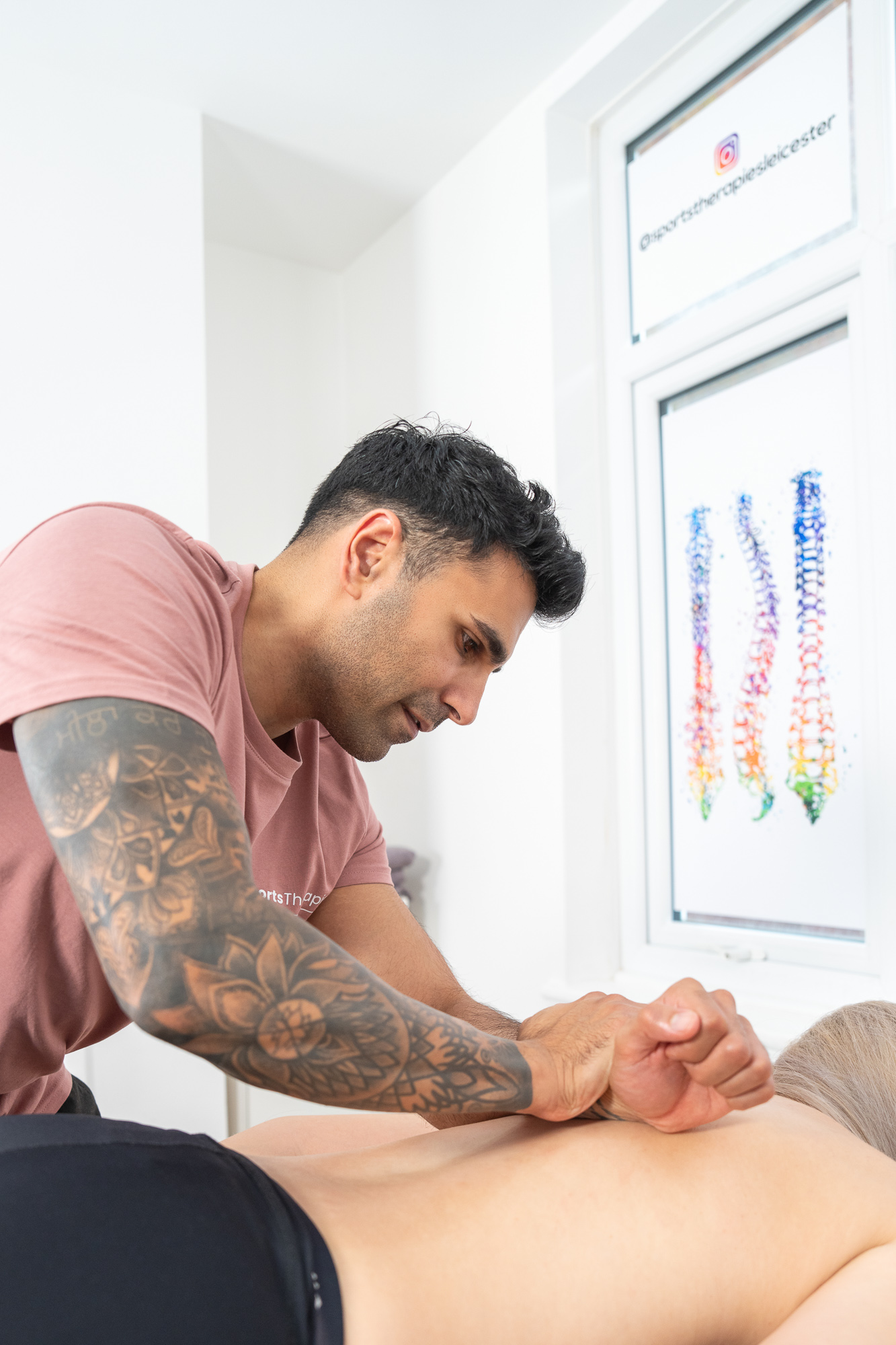 image of Woman receiving Sports Massage Therapy service in Leicester